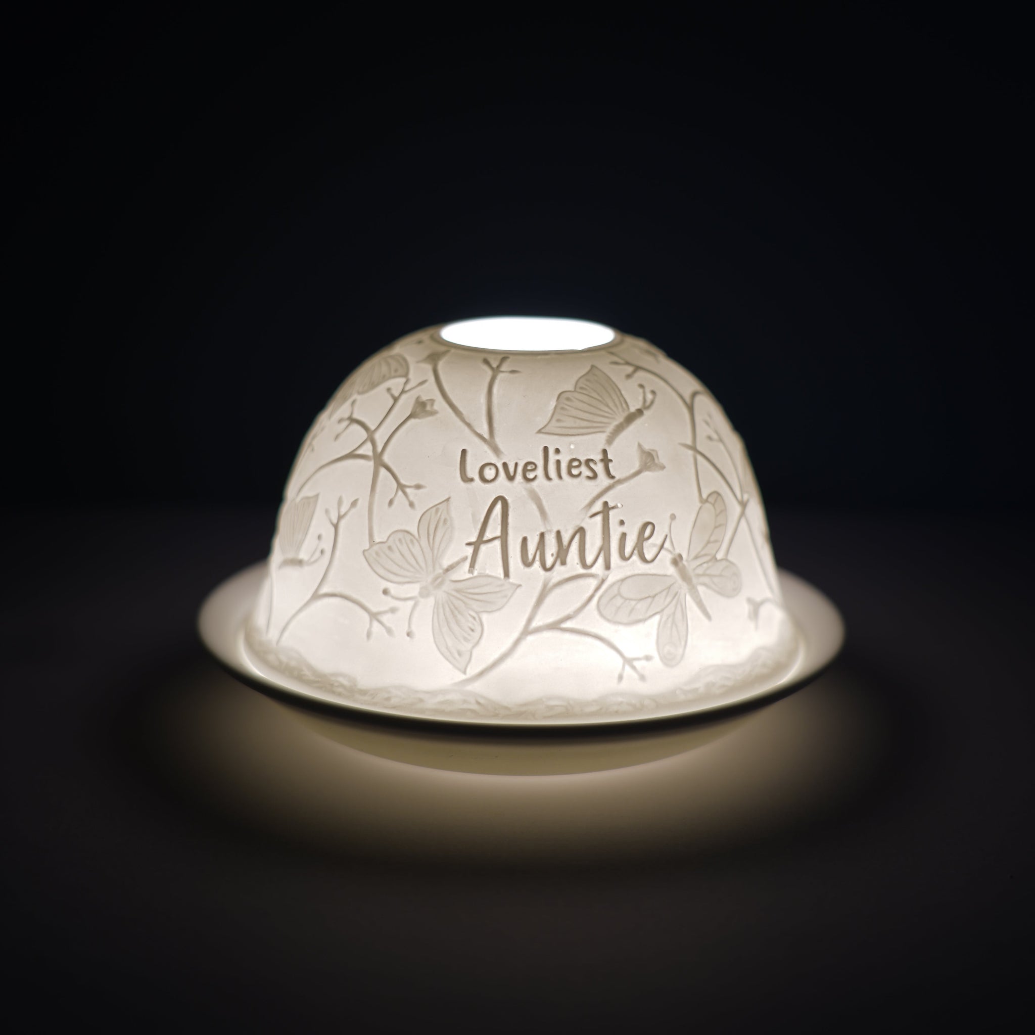 Cello porcelain tealight holder dome, in our loveliest Auntie design. This design displays the text loveliest Auntie over a backdrop of nature with butterflies. We offer a wide range of porcelain tealight holders to let you choose your show stopping piece and show it off with pride when guests and family are over.  Pick your preferred option between LED lights or using tealight candles.