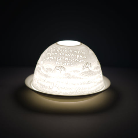 Cello porcelain tealight holder dome, in our paw print design. This design displays the text "Our best friends often leave paw prints on our heart" over a natural wildlife back drop. We offer a wide range of porcelain tealight holders to let you choose your show stopping piece and show it off with pride when guests and family are over. Pick your preferred option between LED lights or using tealight candles. 